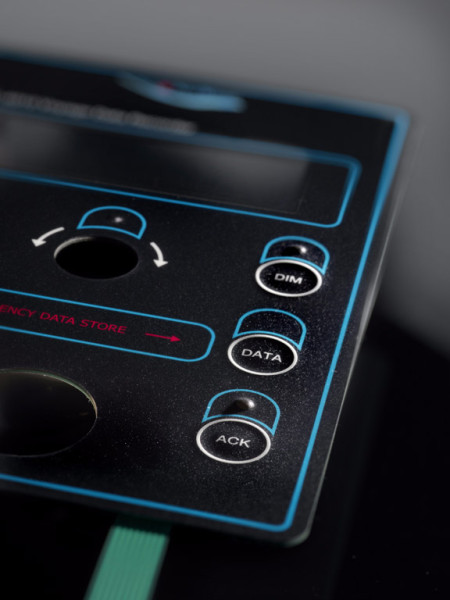 Membrane switch for industrial control; embossed DIM/DATA/ACK keys, rotary selector, LCD window and ZIF tail connector.